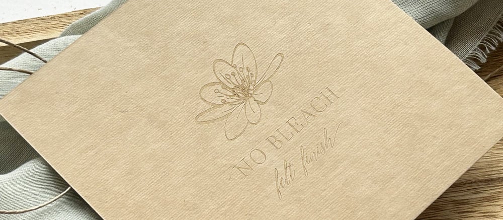 Organic cardstock with laser engraving for natural looking designs