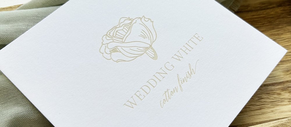 Example of laser engraving on white cotton card stock