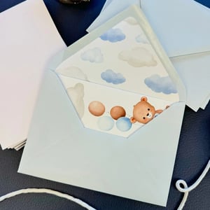 Light sky blue baby shower invite inside a A7 envelope