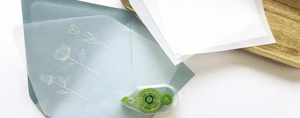 Tape roller for vellum lined envelopes