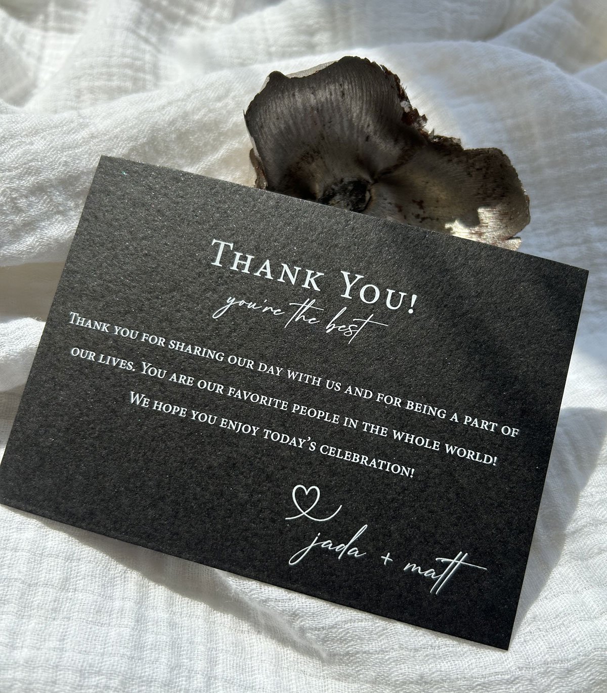 Black and white wedding thank you card printed in white on black textured paper