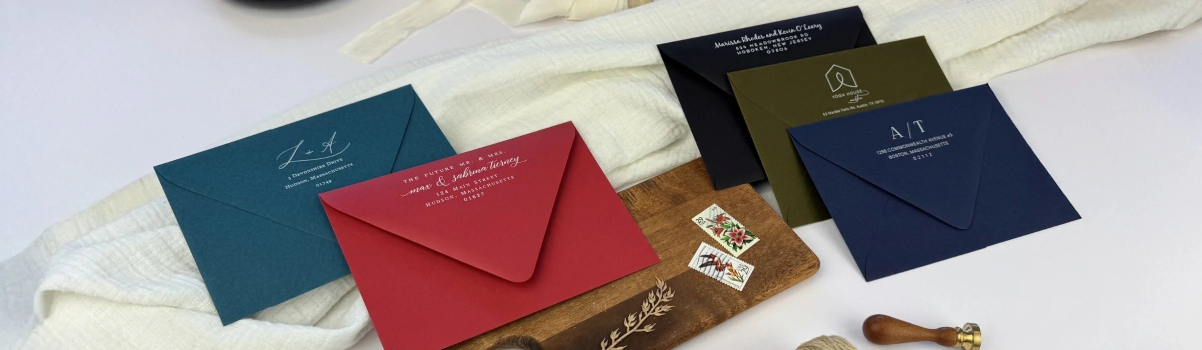 White Ink Printed Envelopes Shown here: Dark Teal Blue, Scarlet Red, Ebony Black, Forest Green, & Midnight Blue