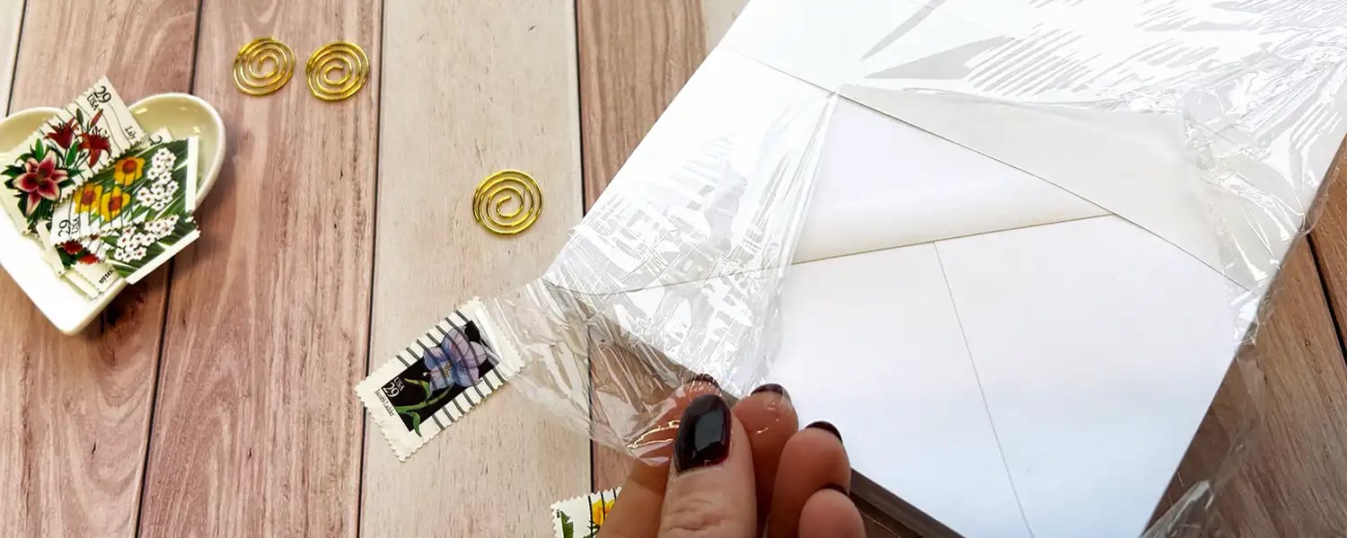 How to fix curled envelopes in the winter: Unwrap envelopes to allow moisture in