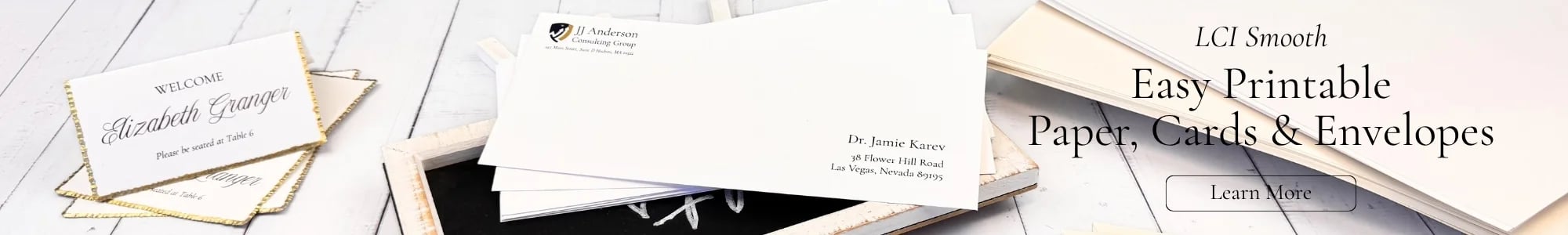 Shown here: radiant white gold foil place cards with black ink printing, radiant white #10 business envelope printed with professional logo, next to Radiant White and creamy Ecru stacked paper. Click to learn more about easy printable paper, cards, & envelopes