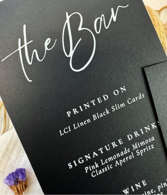 linen finish texture with white ink printing on Epic Black bar menu