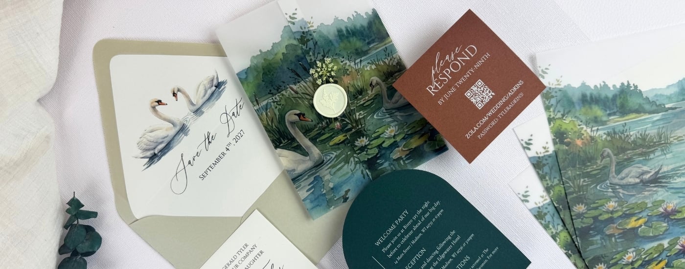Elegant wedding stationery set featuring printed swans on a Wedding White liner inside of a Light Moss envelope with a printed vellum wrap, Dark Teal Blue half arch details card, rustic Sepia RSVP card, and Wedding White invitation from LCI Paper